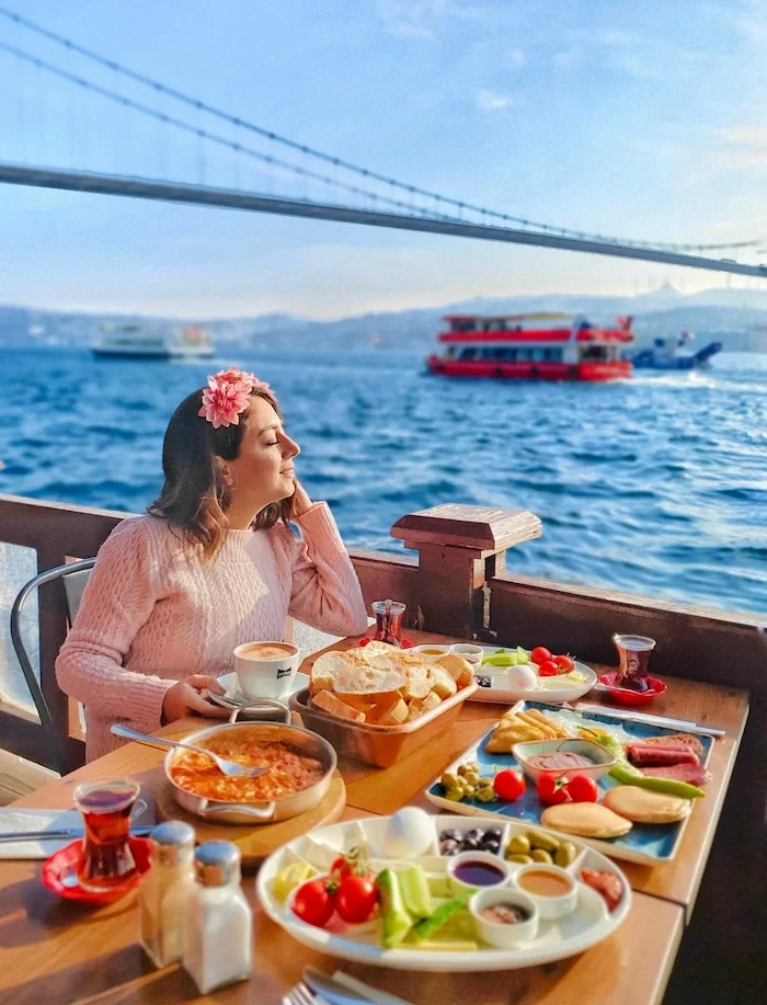 Enjoying a traditional Turkish breakfast by the Bosphorus as part of a relaxing dental trip to Istanbul.
